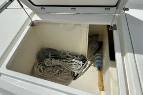 Open storage compartment on 2021 Leopard 50 yacht with ropes and equipment.