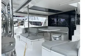 Spacious outdoor seating area on a 2022 Leopard 45 catamaran yacht.