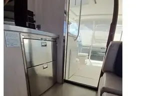 Interior of 2018 Leopard 45 yacht showing kitchen area and sliding door.