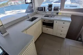 Modern kitchen interior on 2018 Leopard 45 yacht with appliances and ocean view.