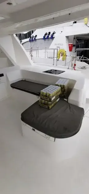 2019 Leopard 51 Powercat interior seating area with stacked beverage cans.