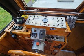 Control panel of a 1921 Classic Dutch Barge with vintage navigation equipment.