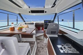 Jeanneau Merry Fisher 795 Legend - wheelhouse with port side table and starboard side galley