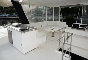 2018 Leopard 43 Powercat yacht interior with seating and kitchenette.