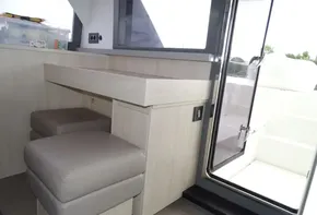 Interior of 2017 Leopard 45 yacht with modern seating and access to deck.