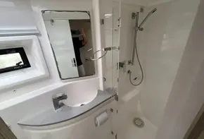 Modern bathroom in 2019 Leopard 51 Powercat yacht with shower and sink.