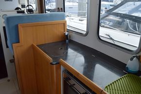 Galley with oven, sink and fridge