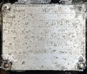 Weathered metal plate with model and technical specifications, dated January 2020.