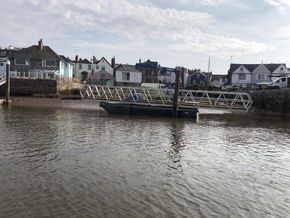 The uniflote with the spud legs down holding a gangway. 