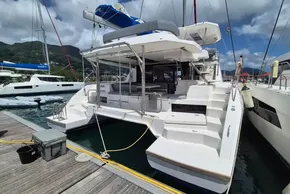 2021 Leopard 45 catamaran docked at marina, showcasing spacious deck and modern design.