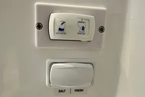 Control panel on a 2025 Robertson and Caine Leopard 46 Powercat, featuring water and pump switches.