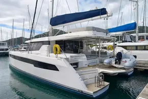 2019 Leopard 50 yacht docked in marina, featuring sleek design and spacious deck.