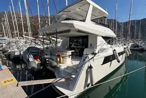 2024 Leopard 40 Powercat yacht docked in a marina with surrounding sailboats.