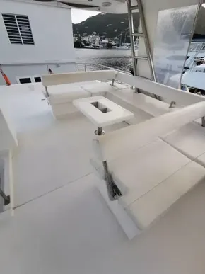 2017 Leopard 51 Powercat yacht with spacious outdoor seating area.