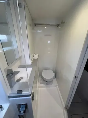 Modern bathroom in 2019 Leopard 45 yacht, featuring sleek design and compact layout.