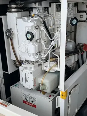 Engine compartment of a 2021 Leopard 45 yacht, showcasing mechanical components and wiring.