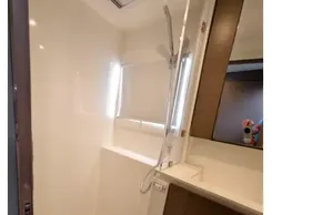 Modern shower area in 2021 Leopard 50 yacht, featuring sleek design and wood accents.