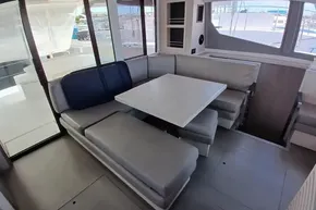 2018 Leopard 45 yacht interior with modern seating and dining area.