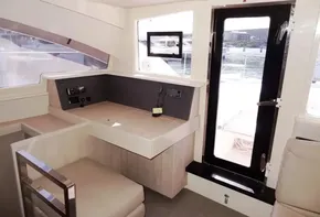 Interior of 2015 Leopard 51 Powercat yacht with modern seating and navigation area.