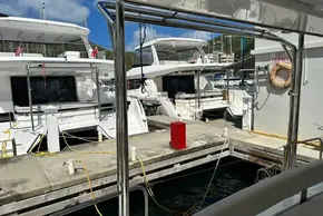 2025 Robertson and Caine Leopard 46 Powercat docked at marina with safety equipment.