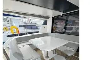 Luxurious 2019 Leopard 50 yacht interior with sleek seating and modern dining area.