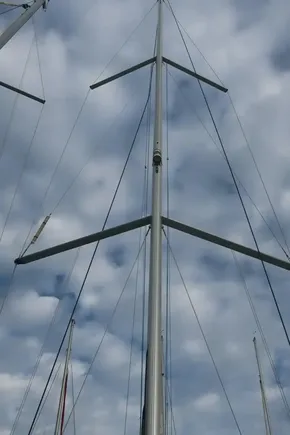 Mast of 2019 Beneteau Oceanis 41.1 sailboat against cloudy sky.