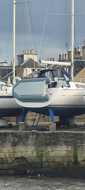 dinghy stored on transom davits