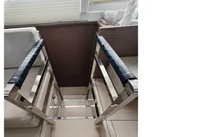 Modern interior of a 2021 Leopard 50 yacht with sleek metal and leather accents.