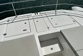 2025 Robertson and Caine Leopard 46 Powercat deck with storage compartments and seating.