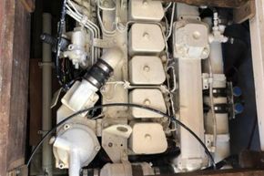 Engine compartment of a 1989 Princess 35 Flybridge yacht, showcasing mechanical components.