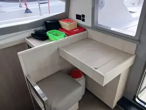Interior of a 2021 Leopard 40 yacht with a compact desk and storage area.