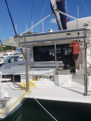 Leopard 40 catamaran, 2020 model, docked at marina with person on deck.