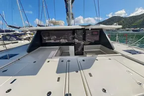 2021 Leopard 50 catamaran deck with scenic marina and mountain backdrop.
