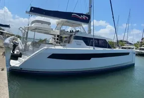 2020 Leopard 50 catamaran docked at marina under clear blue sky.