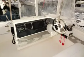 2017 Leopard 43 Powercat helm station with navigation equipment and steering wheel.
