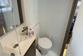 Bathroom interior of 2025 Robertson and Caine Leopard 46 Powercat, featuring sink and toilet.