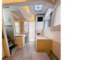 Modern interior of 2020 Leopard 50 yacht, featuring sleek wood finishes and ample natural light.