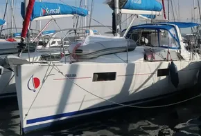 2019 Beneteau Oceanis 41.1 sailboat docked in marina, blue sails, sunny day.