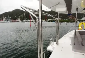 Leopard 50 yacht docked in a marina with scenic mountain backdrop, 2020 model.