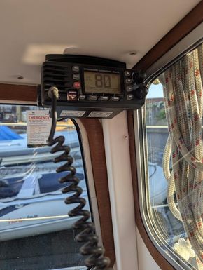 Fixed VHF radio linked to GPS for MOB 