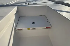 2024 Leopard 40 Powercat deck storage compartment with safety warnings.