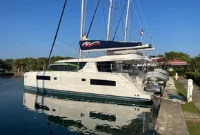 2021 Leopard 45 catamaran docked in a sunny marina setting.