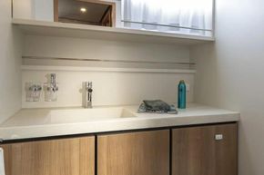 Modern bathroom interior of 2025 Linssen 45 SL Sedan yacht, featuring sleek sink and cabinetry.