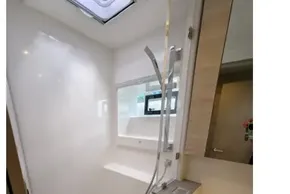 Modern shower area in 2020 Leopard 50 yacht, featuring sleek design and natural lighting.