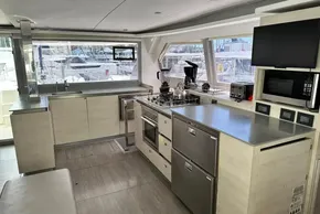 Modern kitchen interior on 2021 Leopard 50 yacht, featuring appliances and sleek design.