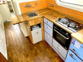 The kitchen is well equipped and includes brand-new fridge freezer and hob