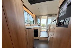 Interior view of 2025 Linssen 45 SL Sedan yacht, featuring modern wood finishes and sleek design.