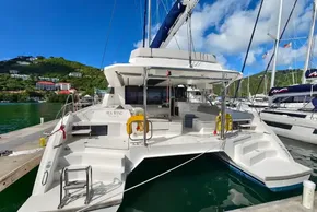 2021 Leopard 50 catamaran docked in a scenic marina with lush hills.