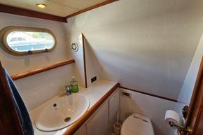 Bathroom interior of 2005 Stevens 1200 Vlet yacht with sink and toilet.