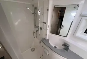 Modern bathroom in 2019 Leopard 51 Powercat yacht with shower and sink.